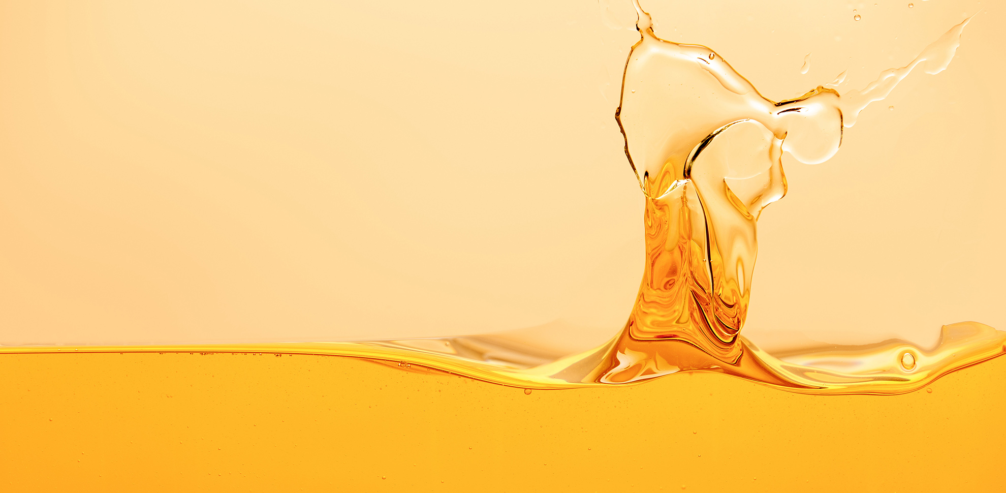 yellow bright liquid with splash isolated on yellow